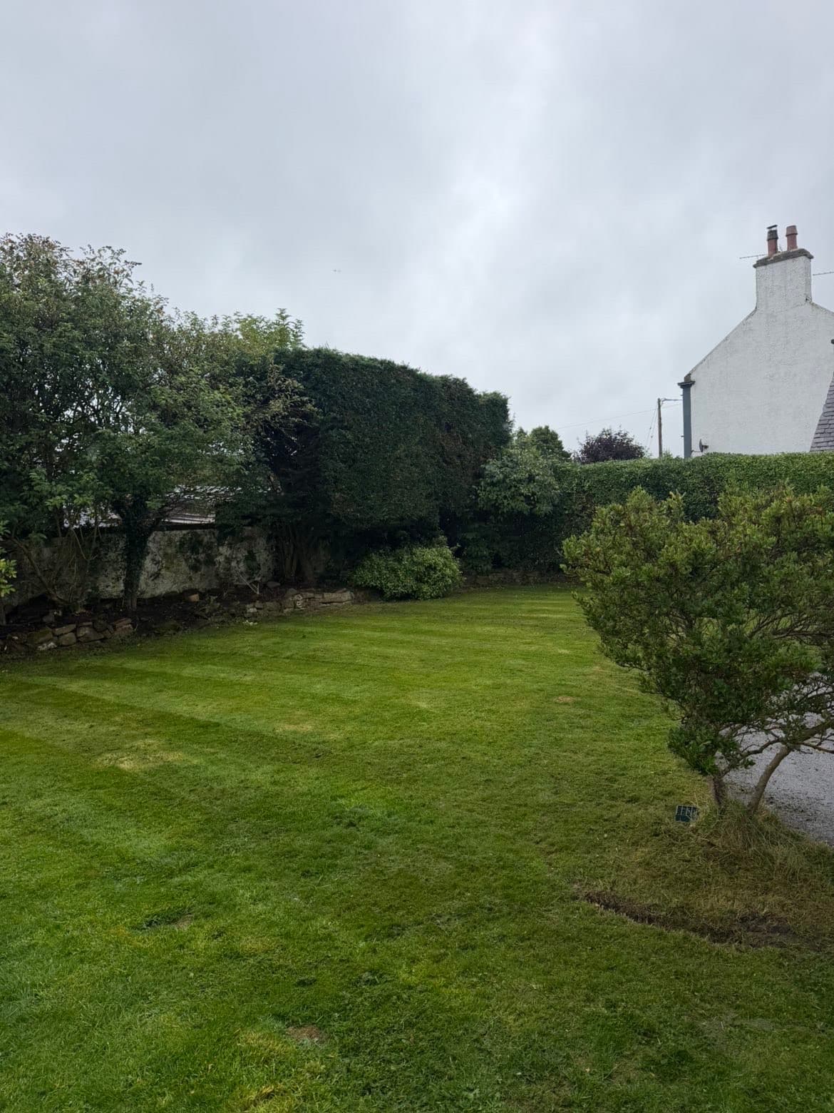 Freshly cut and striped lawn after grass cutting in Lochmaben