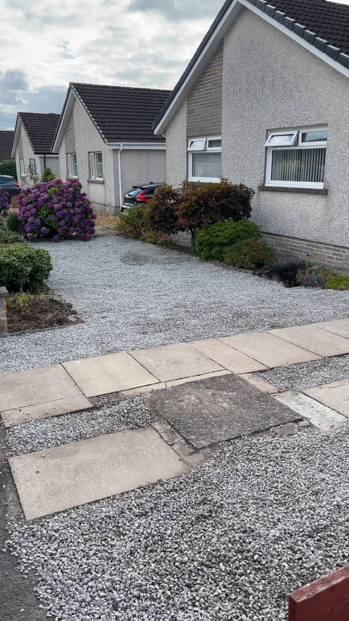 Landscaped garden with decorative stone and paving completed by RML Ground Maintenance in Dumfries and Galloway