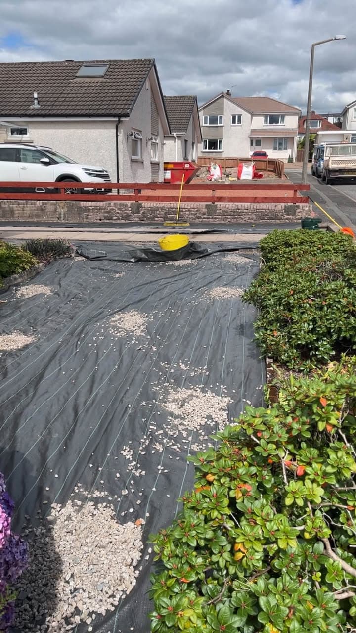 Weed membrane being laid during a garden landscaping project in Dumfries and Galloway